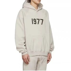 Essentials Cream Hoodie with Black Print